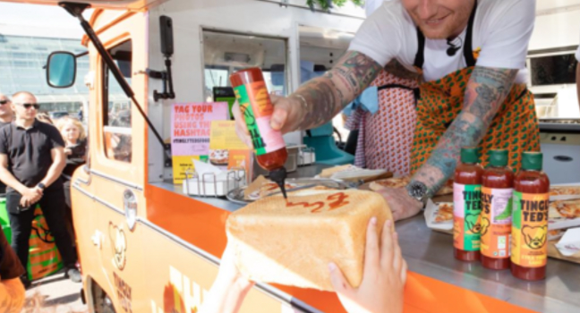 Ed Sheeran Surprises Fans by Signing Autographs with His Hot Sauce