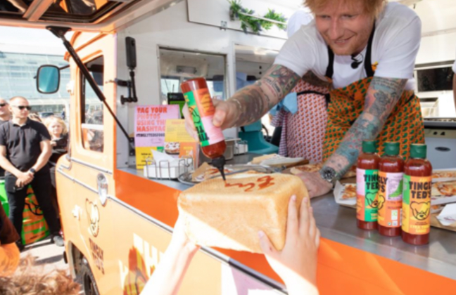Ed Sheeran Surprises Fans by Signing Autographs with His Hot Sauce